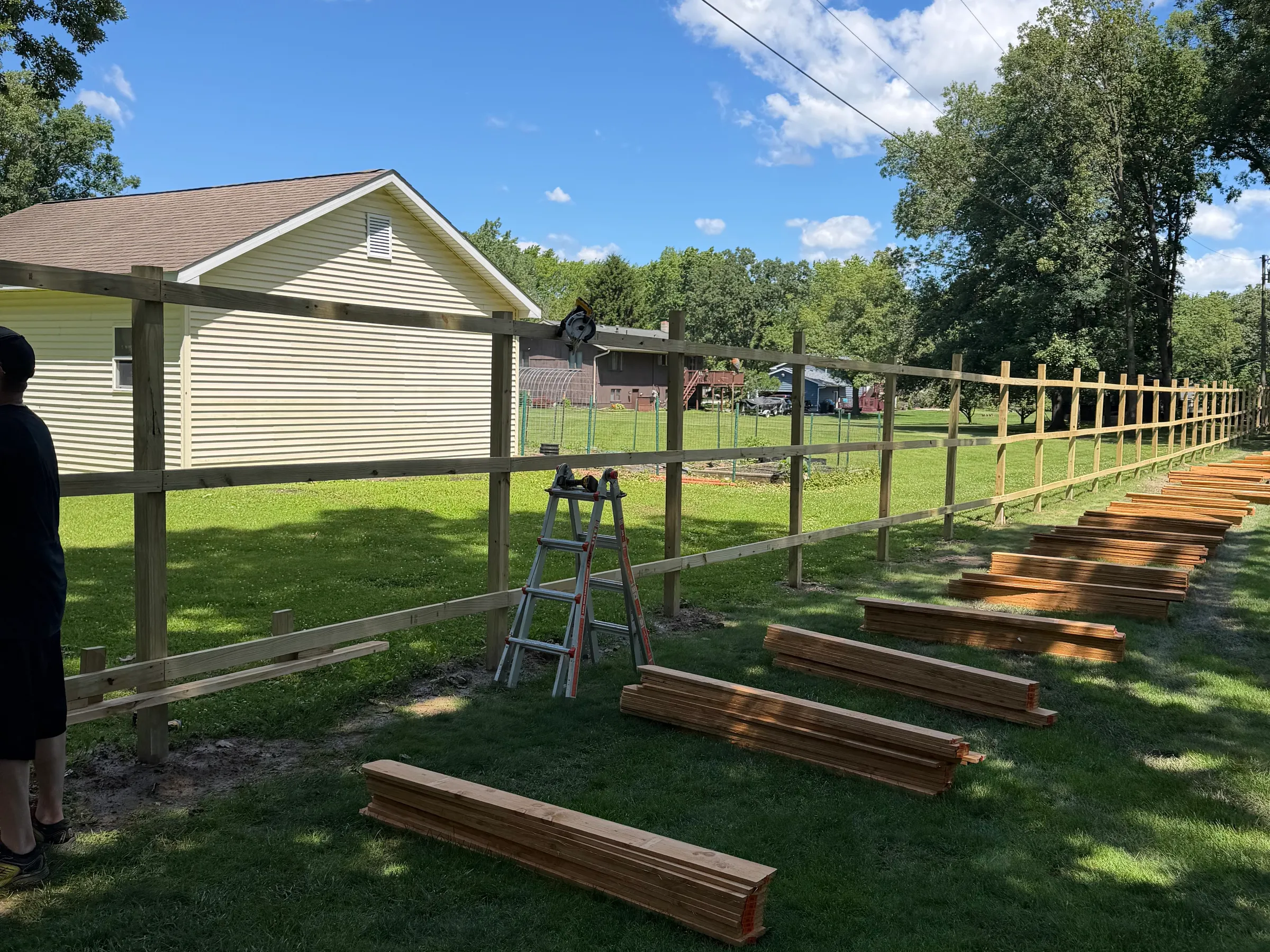 Exterior view showing new siding installation with proper window flashing, integrated accessories, seamless color matching, and complete structural envelope restoration across entire visible wall section.